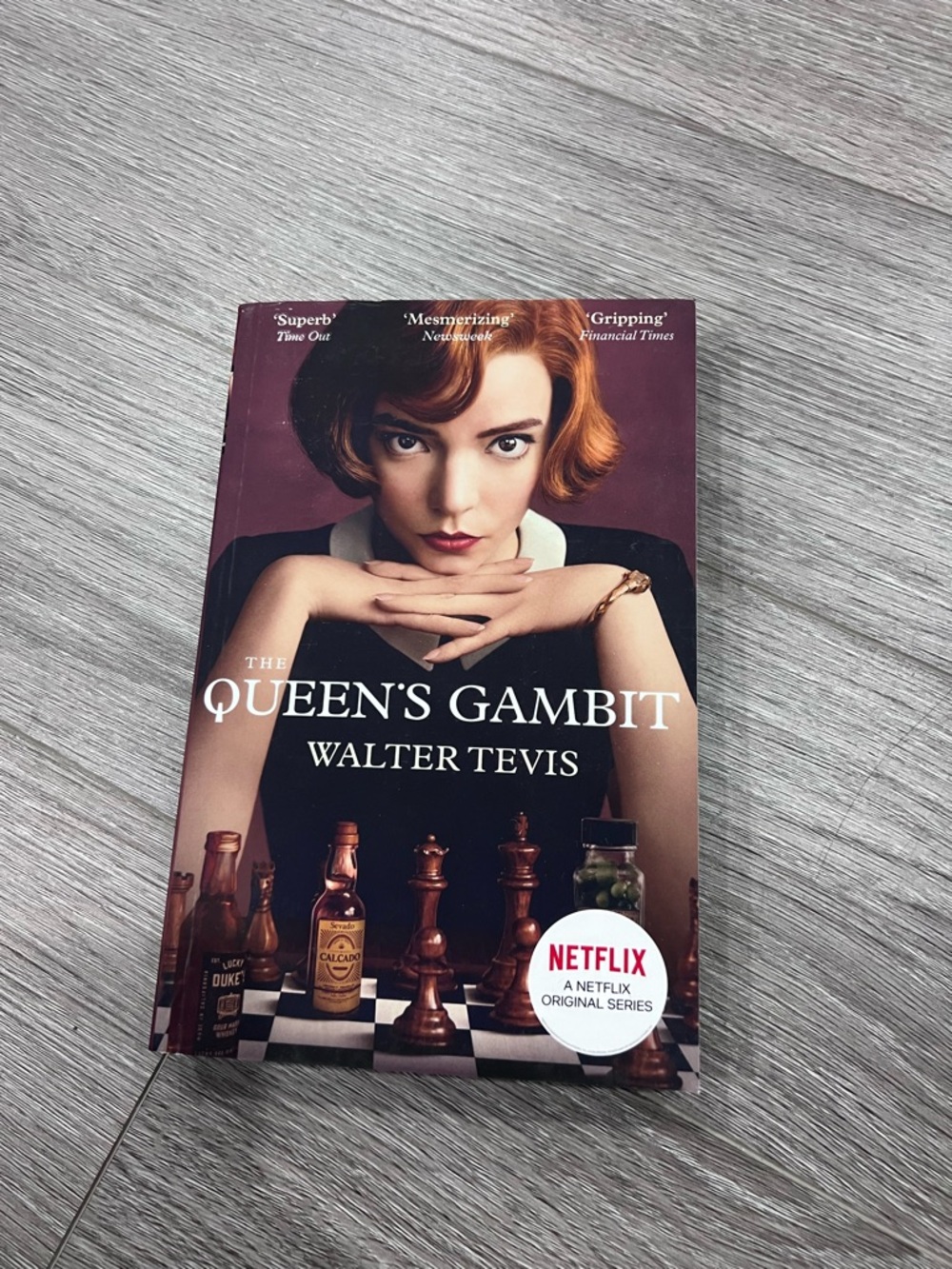 Indigo The Queen's Gambit Paperback with Brown and Black Cover Art